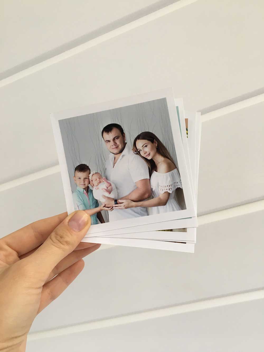 The paper printed out photos of happy family with the newborn baby
